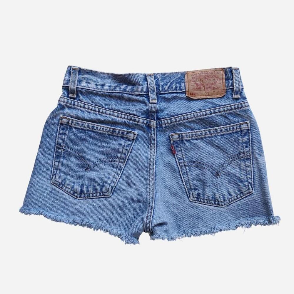vintage Levi's 550 blue denim micro shorts with a distressed look